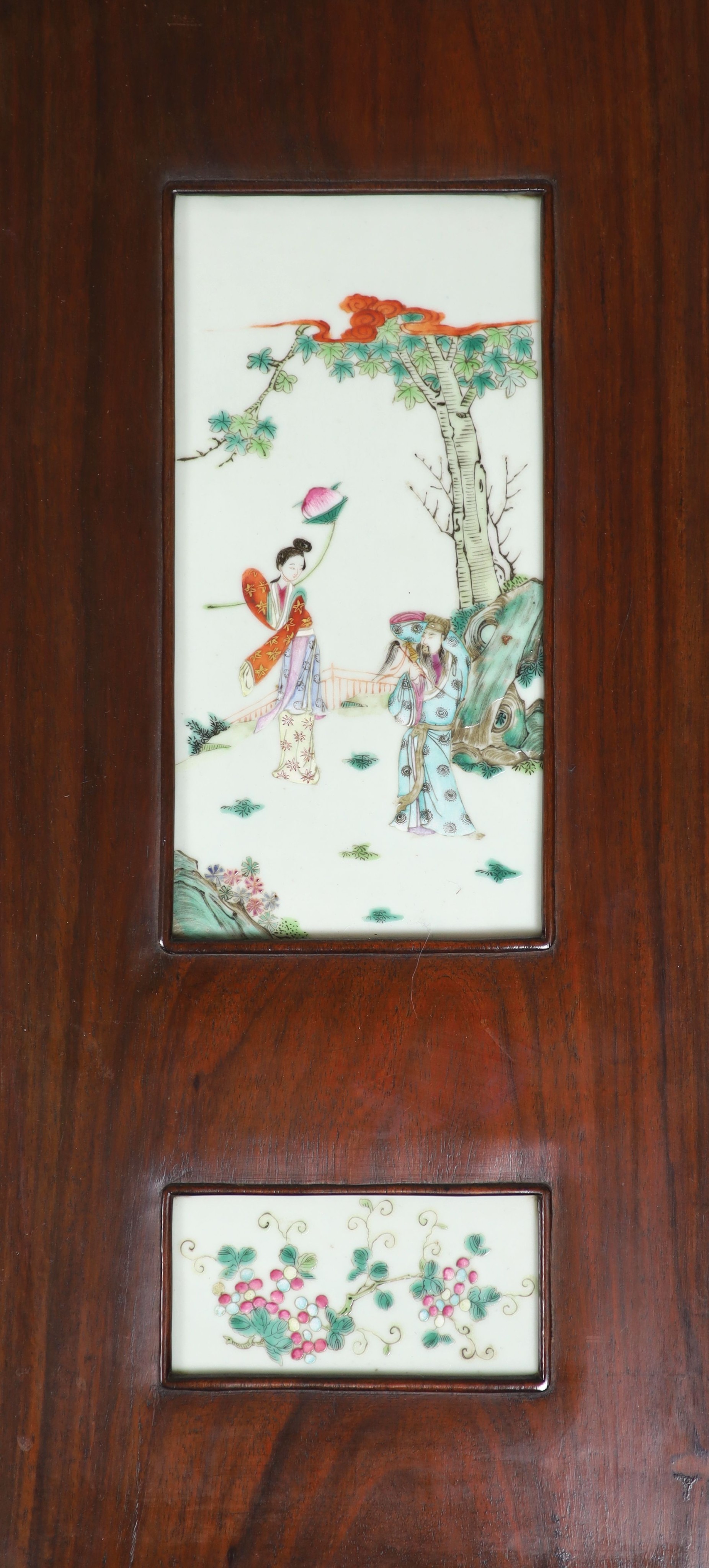 A good Chinese porcelain mounted four fold screen, mid 19th century, the wood possibly zitan, Total size 127cm high x 122cm wide